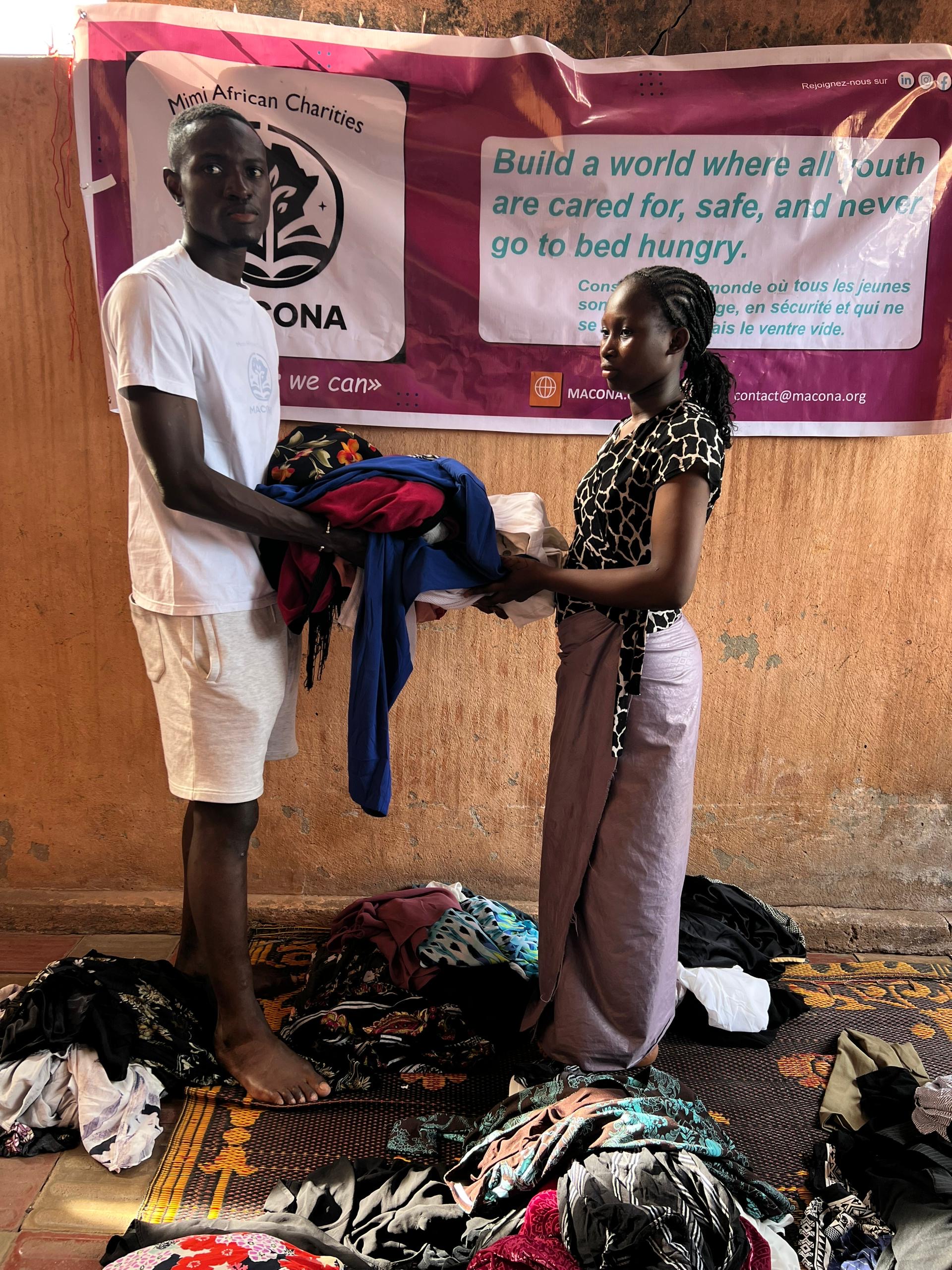 Staff providing clothes to a girl